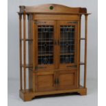 Arts and Crafts period oak display cabinet, labelled 'Bowman Brothers, Camden Town, London', the top