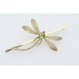 9ct gold dragonfly bar brooch, centred with a round cut peridot, 6mm diameter, and with ruby eyes,