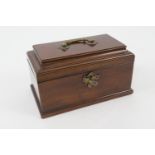 George III mahogany tea caddy, sarcophagus form with brass handle and escutcheon, opening to