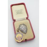 9ct gold and enamelled Northern Motoring Club 1920 medal, gross weight 8.5g; also a 9ct gold and