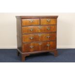 Walnut chest of drawers, 18th Century and later, having an oak two plank top over two short and