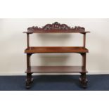 Mahogany metamorphic dumb waiter, the rising top with carved acanthus scroll back over two