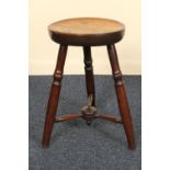 Victorian mahogany dish seated stool, three turned legs with turned stretcher, the seat 27.5cm