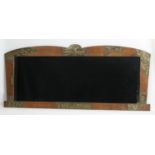 Arts and Crafts copper and stained beech overmantel mirror, surmounted with a hawk holding an arrow,