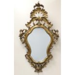 Italian moulded gilt wall mirror, in Baroque style, shaped plate bordered with 'C' and rocaille