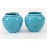 Pair of Burmantofts faience vases, turquoise glazed and with impressed banded decoration, height