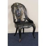 Victorian papier mache chair, circa 1850, having a shaped back decorated with floral bouquets and