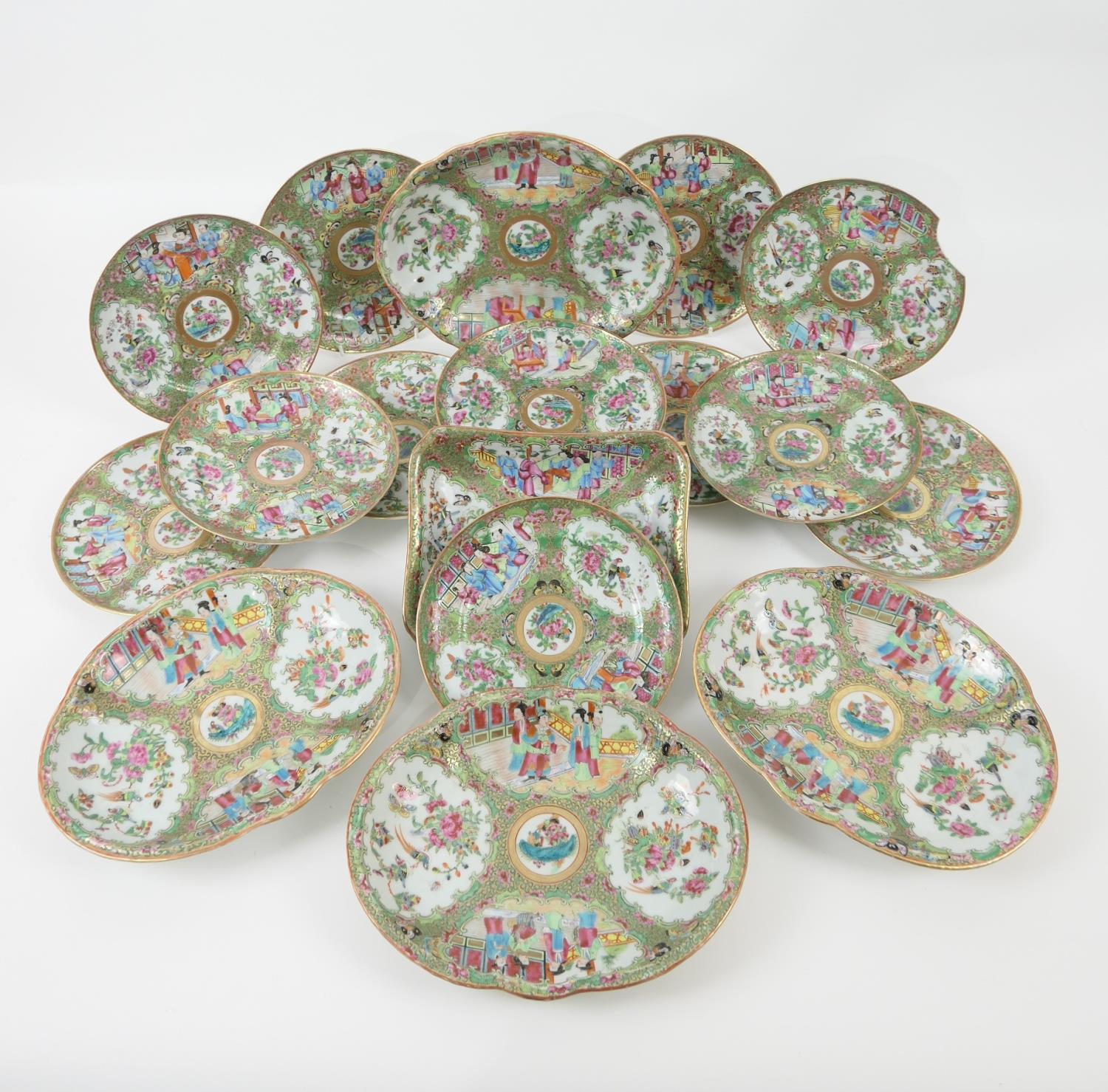 Chinese Canton famille rose dessert service, early 19th Century, typically decorated with panels