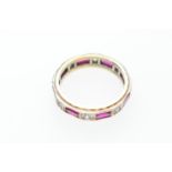 9ct gold eternity ring, set with rectangular cut rubies and round cut white stones, probably