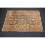 Zieglar style woollen carpet, the abrashed blue field with an allover floral design within a broad