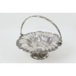 Victorian silver plated table basket, fluted circular form with swing handle, raised on a trumpet