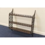 Late Victorian mahogany wall shelf, in Chippendale Revival style, having three shelves with fretwork