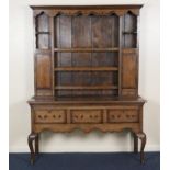 Small oak dresser and plate rack, in the Georgian style, the boarded back with three shelves flanked