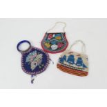 Three decorative Continental beadwork evening bags, one featuring a gunship (damages throughout)