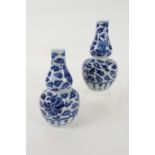 Pair of Chinese blue and white gourd vases, late 19th Century, decorated with lotus flower scrolls