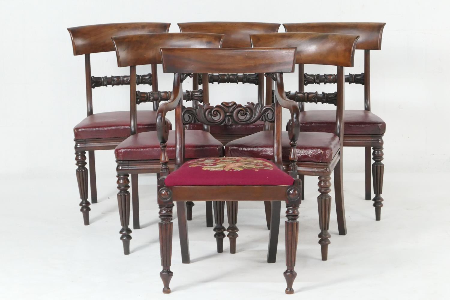 Set of five George IV mahogany dining chairs, circa 1825-30, each with curved top rail and carved