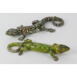 Two Portuguese majolica lizard wall ornaments, one finished in speckled green and ochre,