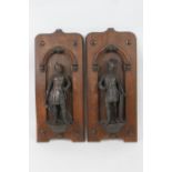 Pair of French bronzed spelter niche figures of knights, circa 1900, each with a stained wooden