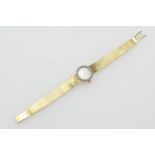 Omega lady's 18ct gold and diamond cocktail watch, the circular champagne coloured dial with baton