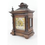 German walnut bracket mantel clock, circa 1900, architectural style case with turned finials, over a