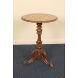 Victorian carved walnut and inlaid pedestal games table, circa 1875, the circular top with