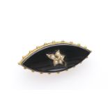 Victorian mourning brooch, centred with a pearl set ivy leaf against a navette cut black onyx, in