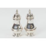 Matched pair of silver pepper pots, one Charles Stuart Harris, London 1897, the other Birmingham