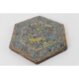 Qajar decorated hexagonal tile, centred with a bird amidst foliage within a blue wavy floral border,