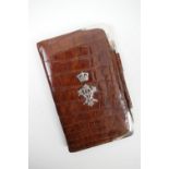 Queen Victoria interest: a late Victorian silver mounted crocodile skin note wallet by Drew &