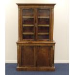 Victorian walnut and inlaid bookcase cabinet, circa 1870, having two glazed upper doors opening to