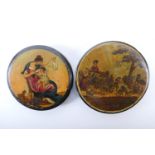 Two papier mache circular snuff boxes, each with printed cover decoration, 9cm and 8.5cm diameter