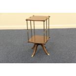 Mahogany and brass revolving magazine stand, shaped square form with brass columns/divisions, over