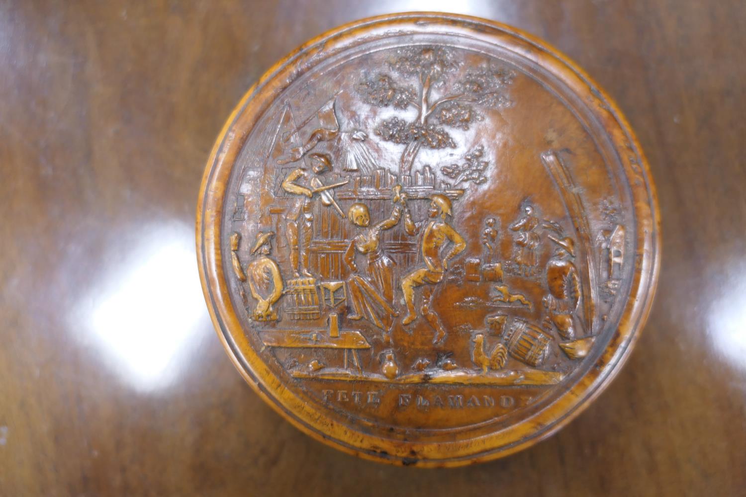 Pressed burr wood circular snuff box, 19th Century, the cover decorated with a scene of revellers, - Image 2 of 7