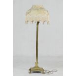 Brass corinthian column extendable standard lamp, have a gold damask and tasselled silk umbrella