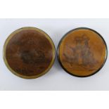 Two print decorated papier mache snuff boxes, each of circular form, one with a print of 'Mrs