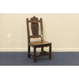 Welsh carved oak side chair, circa 1900, with carved back, the seat carved with a leek, height 102cm