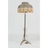 Edwardian brass extending standard lamp, in Art Nouveau style, having a purple silk damask fringed