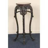 Chinese carved rosewood jardiniere stand, late 19th Century, the octagonal beaded top with marble