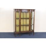 Edwardian mahogany concave fronted display cabinet, circa 1900-10, with ebony line inlays, the