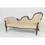 Victorian walnut and upholstered chaise longue, the serpentine shaped spoon back with deep button