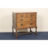 Oak chest on stand, in William and Mary style, fitted with two short and two long drawers, with