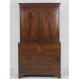 Regency mahogany and inlaid secretaire bookcase, circa 1820, having an inlaid dentil cornice over