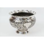 Edwardian silver rose bowl, by Henry Adams, Sheffield 1901, repousse decorated with foliate scrolls,