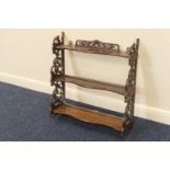 Victorian walnut small open wall display shelf, with serpentine fronted shelves, within scrolling