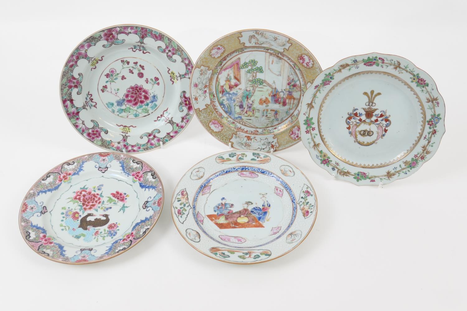 Five Chinese famille rose plates, all 18th Century, including an armorial plate, 22.5cm; Mandarin