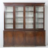 Late 19th Century mahogany and inlaid breakfront library bookcase, in Georgian style, having a