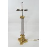 French ormolu and grey glass table lamp, having two light sockets over an ormolu capped wrythen