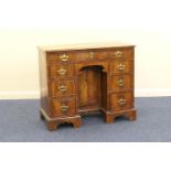 Walnut inlaid kneehole desk, 18th Century, quarter veneered top crossbanded and with ebony and