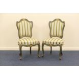 Pair of French painted and parcel gilt side chairs, early 20th Century, with green striped silk