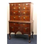 Walnut chest on stand, early 18th Century and later, the top with moulded cornice over three short